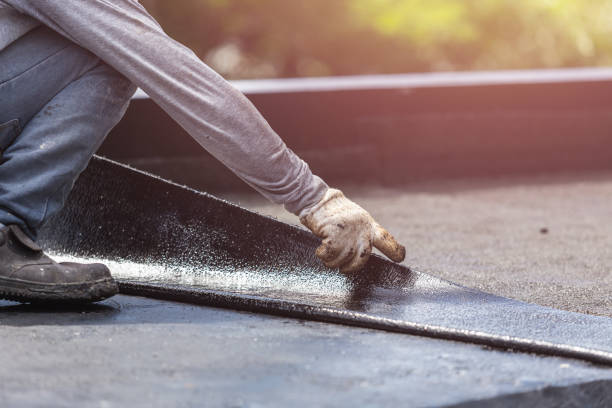 Professional Basement Waterproofing technician working in Brighton, IL